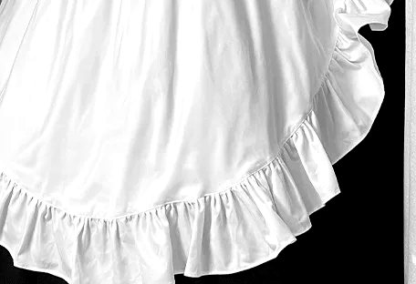 Close-up of a ruffled white apron hem