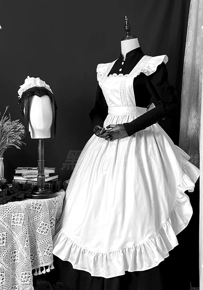 Plate No. III: pleated bib apron over a black dress with white cuffs