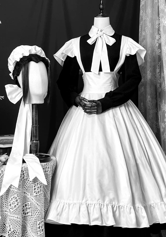 Plate No. IV: black dress with a white bow collar and a cap with long ribbons